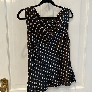 It’s got a brown with white polkadot blouse silk